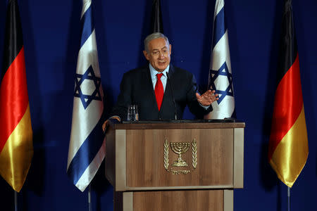 Israeli Prime Minister Benjamin Netanyahu gestures as he speaks during a joint news conference with German Chancellor Angela Merkel in Jerusalem October 4, 2018. REUTERS/Ammar Awad