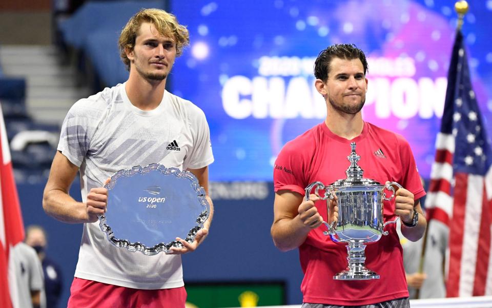 Alexander Zverev of Germany (L) and Dominic Thiem of Austria (R) pose with the finalist and championship trophies (respectively) after their match in the men's singles final match on day fourteen of the 2020 U.S. Open tennis tournament at USTA Billie Jean King National Tennis Center - USA TODAY SPORTS