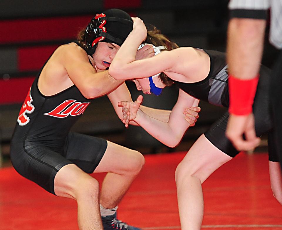 Minerva's Connor Norris, left, wrestles Alliance's Jase Kaiser in the 106-pound class Thursday, December 10, 2020 in an Eastern Buckeye Conference match at Minerva High School.