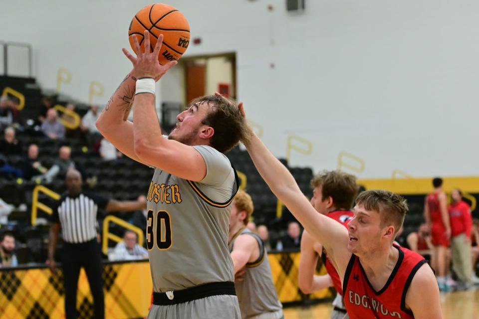 The College of Wooster's Jamir Billings slashes against Edgewood. He finished with 22 points.