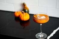 <p>Combine 1¾ oz. bourbon, ¾ oz. pumpkin spice liqueur, ¾ oz. lemon juice, ½ oz. simple syrup, and 1 oz. pumpkin puree in a glass and stir. Garnish with whipped cream and a dusting of cocoa powder.</p><p><em>Recipe from <a href="https://www.theconsulate.nyc/" rel="nofollow noopener" target="_blank" data-ylk="slk:The Consulate" class="link rapid-noclick-resp">The Consulate</a></em></p>