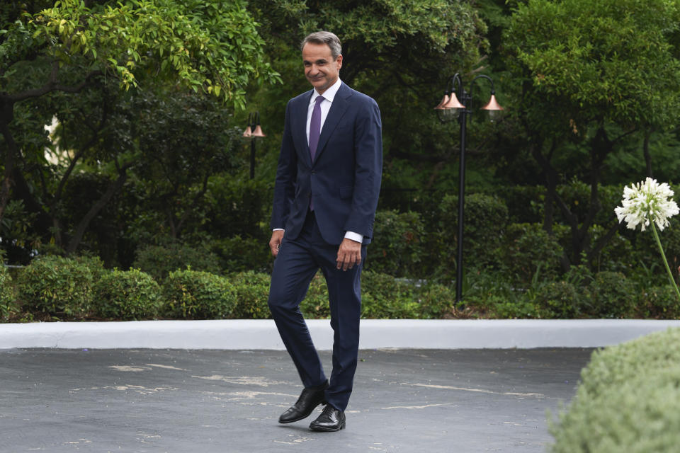 Greece's Prime Minister Kyriakos Mitsotakis arrives to Maximos mansion, premier's office, in Athens, Greece, Monday, June 26, 2023. Greece's center-right leader Kyriakos Mitsotakis was formally sworn in as Prime Minister Monday after easily winning a second term with a record-high margin over the left-wing opposition, in an election that also ushered new far-right parties into Parliament. (AP Photo/Petros Giannakouris)