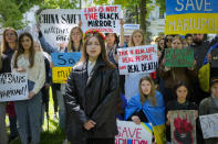 Ukrainian women picket in front of the Chinese embassy in Kyiv, Ukraine, Tuesday, May 17, 2022. Wives and mothers of the defenders of Mariupol call on Turkish President Recep Tayyip Erdogan and Chinese President Xi Jinping to save Ukrainian fighters from the besieged city of Mariupol amid Russia's war. (AP Photo/Efrem Lukatsky)