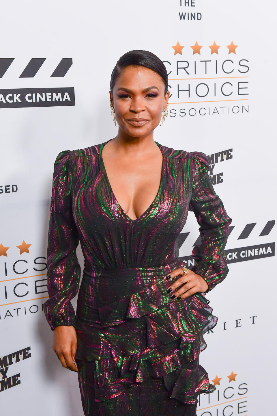 Nia Long wearing pink and green dress