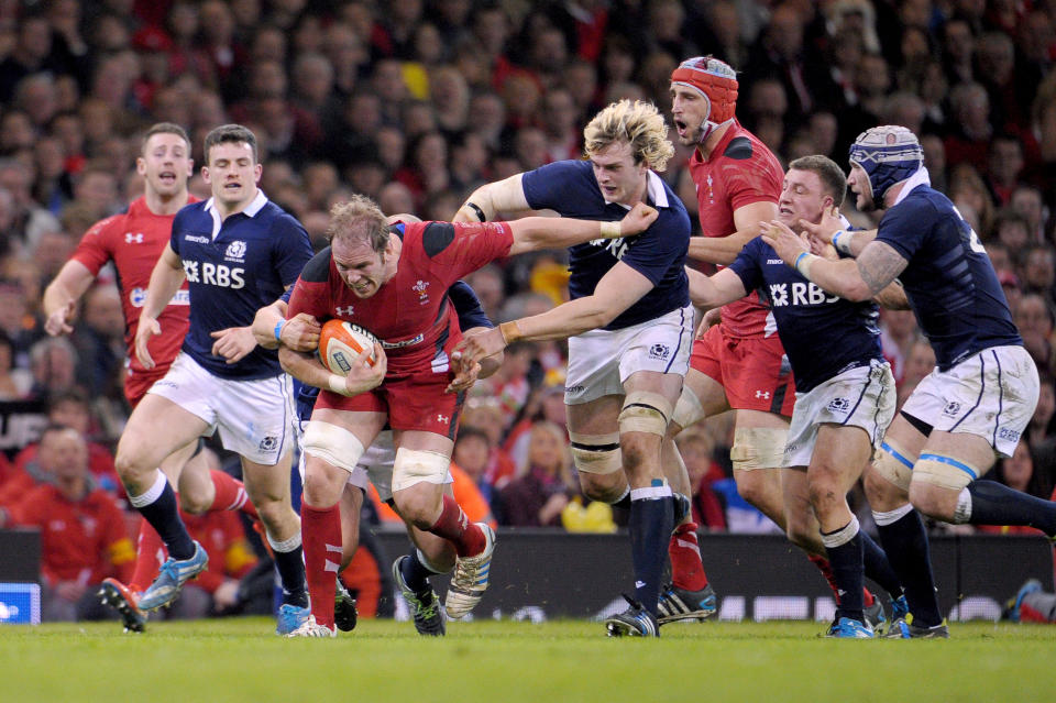 Wales' Alun Wyn Jones, third left, is tackled during the Six Nations rugby union match between Wales and Scotland at the Millennium Stadium, Cardiff, Wales, Saturday, March 15, 2014. (AP Photo/Tim Ireland, PA Wire) UNITED KINGDOM OUT - NO SALES - NO ARCHIVES