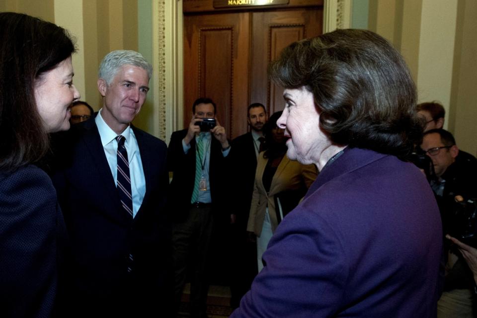 Supreme Court nominee Neil Gorsuch chats with Sens. Kelly Ayotte (left) and Dianne Feinstein on Feb. 1, 2017.  The custom of senators of both parties meeting with Supreme Court nominees seems to be in jeopardy.