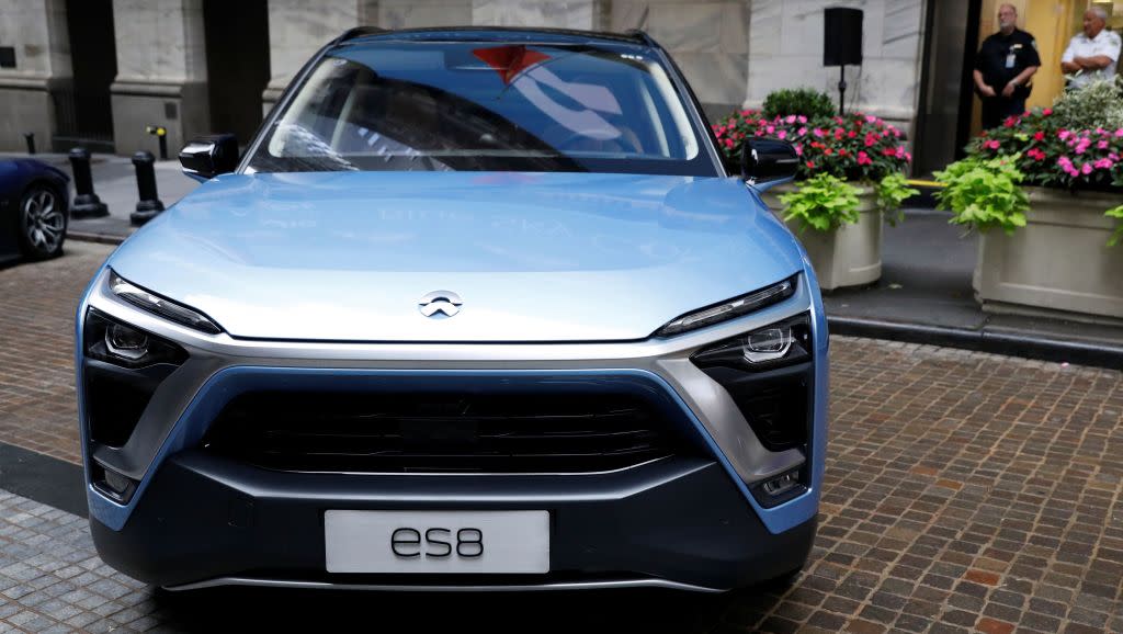 Chinese electric vehicle start-up Nio Inc. vehicles are on display in front of the New York Stock Exchange (NYSE) to celebrate the company’s initial public offering (IPO) in New York, U.S., September 12, 2018. REUTERS/Brendan McDermid - RC17A0FF9580