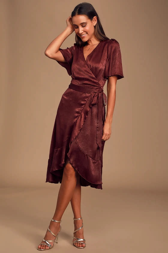 woman wears Wrapped Up In Love Burgundy Satin Faux-Wrap Midi Dress.