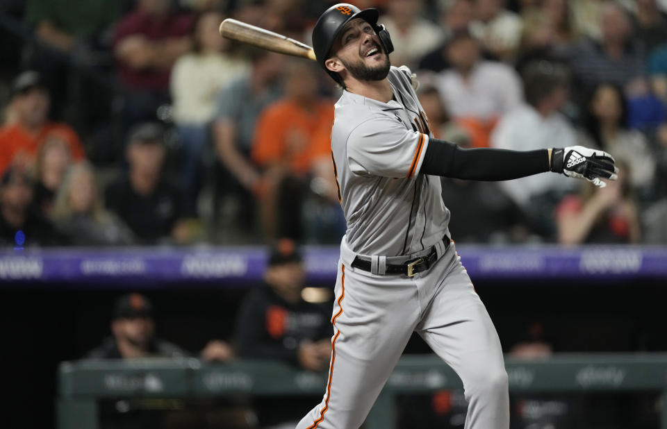 San Francisco Giants' Kris Bryant flies out against the Colorado Rockies in the fourth inning of a baseball game Friday, Sept. 24, 2021, in Denver. (AP Photo/David Zalubowski)