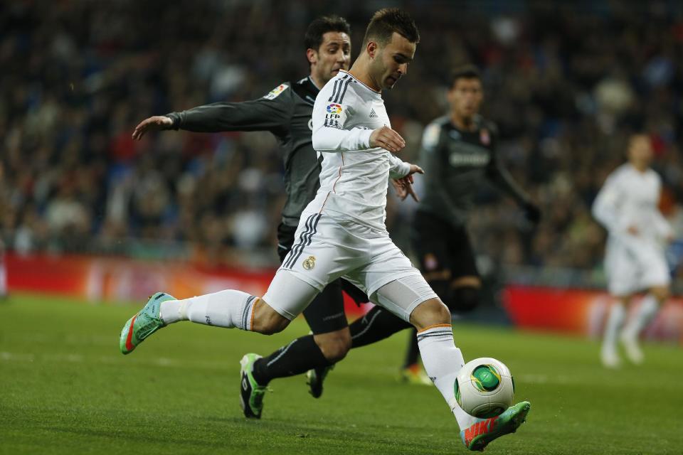 Real Madrid's Jese Rodriguez, front, scores a goal during a Copa del Rey soccer match between Real Madrid and Espanyol at the Santiago Bernabeu stadium in Madrid, Spain, Tuesday, Jan. 28, 2014. (AP Photo/Andres Kudacki)