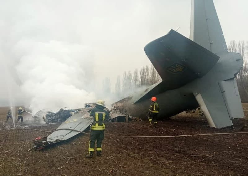 Rescuers work at the crash site of the Ukrainian Armed Forces' Antonov aircraft in Kyiv region