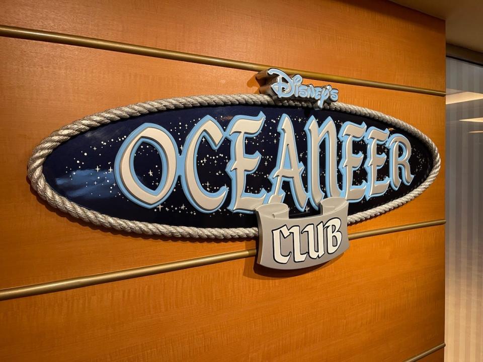 Sign in front of Disney's Oceaneer Club on cruise