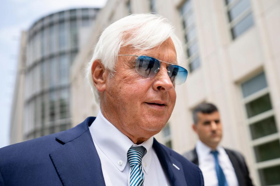 Horse trainer Bob Baffert leaves federal court July 12 in the Brooklyn borough of New York. Split-sample urine testing of Kentucky Derby winner Medina Spirit has shown that a steroid present in the colt's system came from a topical ointment and not an injection, according to an attorney for Baffert.