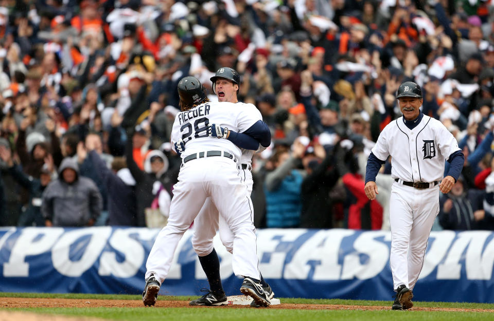 Don Kelly and Prince Fielder (28) celebrate the Tigers' win on Sunday. (Getty)