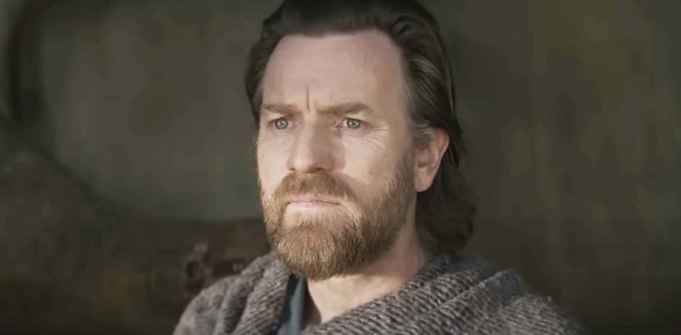 Ewan with a beard, mustache, and long hair