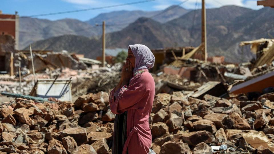 PHOTO: A woman reacts near the rubble of a building in the aftermath of a deadly earthquake in Talat N'yaaqoub, Morocco, Sept. 11, 2023. (Hannah Mckay/Reuters)