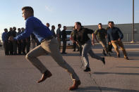 <p>U.S. Border Patrol trainees run upon their initial arrival to the U.S. Border Patrol Academy on August 2, 2017 in Artesia, N.M. (Photo: John Moore/Getty Images) </p>