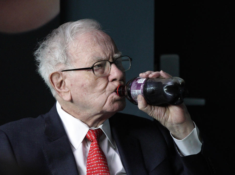 Warren Buffett, chairman and CEO of Berkshire Hathaway, drinks Cherry Coke while playing bridge outside Berkshire-owned Borsheims jewelry store in Omaha, Neb., Sunday, May 6, 2018. On Saturday, tens of thousands of Berkshire Hathaway shareholders attended the annual Berkshire Hathaway shareholders meeting. (AP Photo/Nati Harnik)