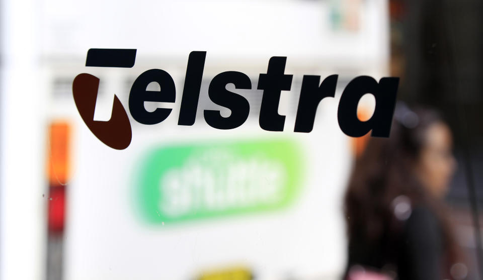 The Telstra name is painted on the side of a phone booth in Sydney, Australia, Thursday, Aug. 11, 2011. Telstra Corp., Australia's largest telecommunications company, reported a 17 percent fall in annual profit to 3.2 billion Australian dollars (US$3.3 billion). (AP Photo/Rick Rycroft)