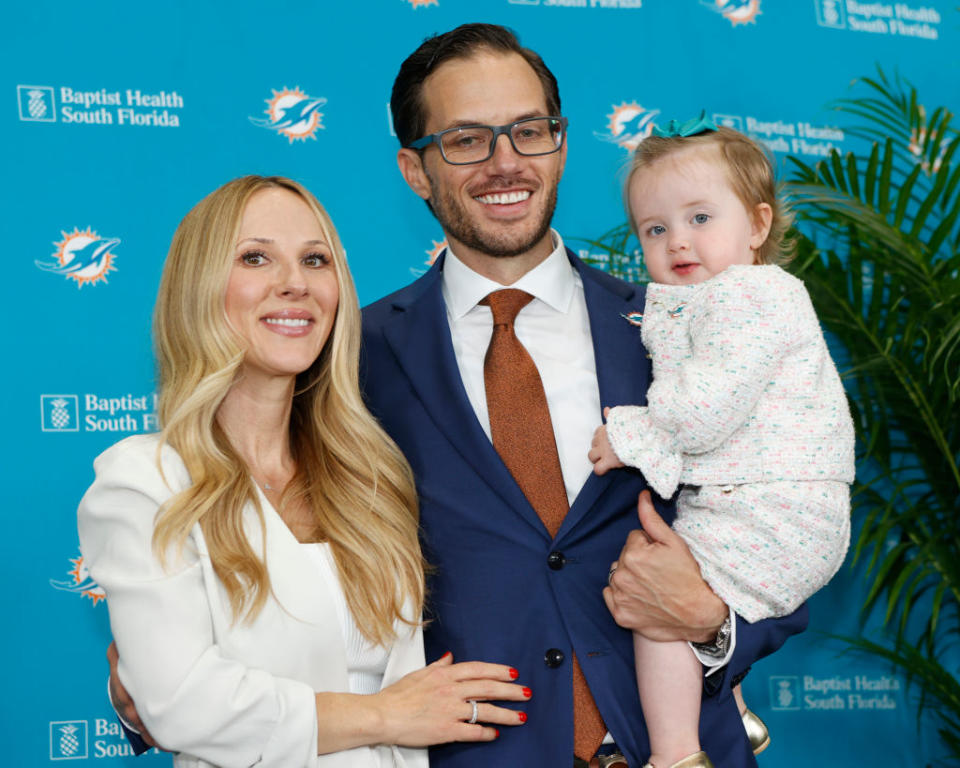 MIAMI GARDENS, FL - FEBRUARY 10: Head coach Mike McDaniel of the Miami Dolphins poses with his wife Katie Daniel and daughter Ayla after being introduced to the media on February 10, 2022 at the Miami Dolphins Baptist Health Training Complex in Miami Gardens, Florida. (Photo by Joel Auerbach/Getty Images)