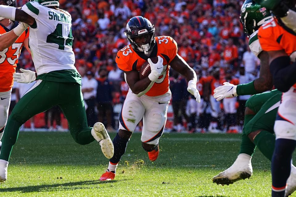Denver Broncos running back Javonte Williams (33) carries the ball in the against the New York Jets at Empower Field at Mile High.