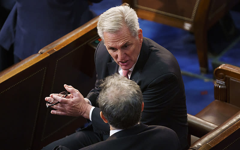 Rep. Kevin McCarthy (R-Calif.) speaks with Rep. Andrew Clyde (R-Ga.) following the seventh ballot for Speaker on Jan. 5. <em>Greg Nash</em>