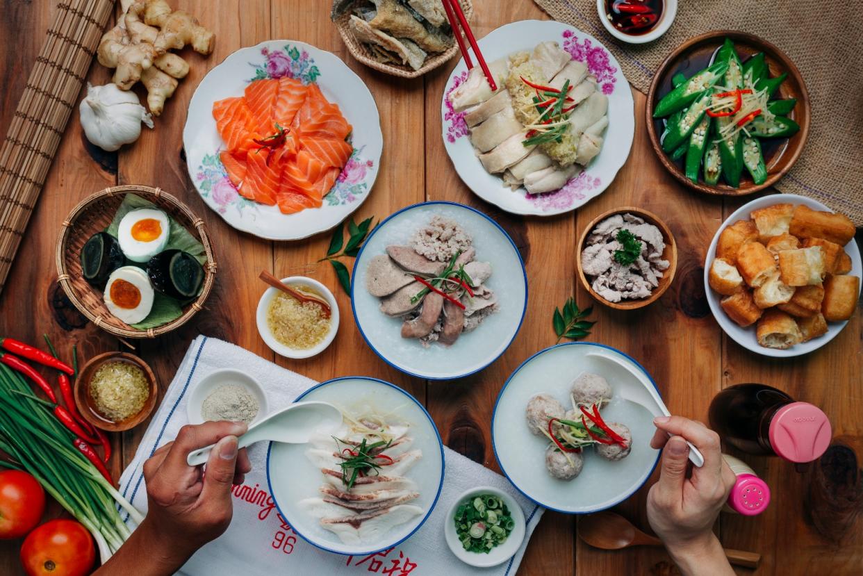 From clockwise: Salmon Yusheng, Ginger Chicken, Thai Style Ladyfinger, You Tiao, Pork Ball Porridge, Fish Porridge and Mixed Pork Porridge. (PHOTO: Ah Chiang’s Porridge).