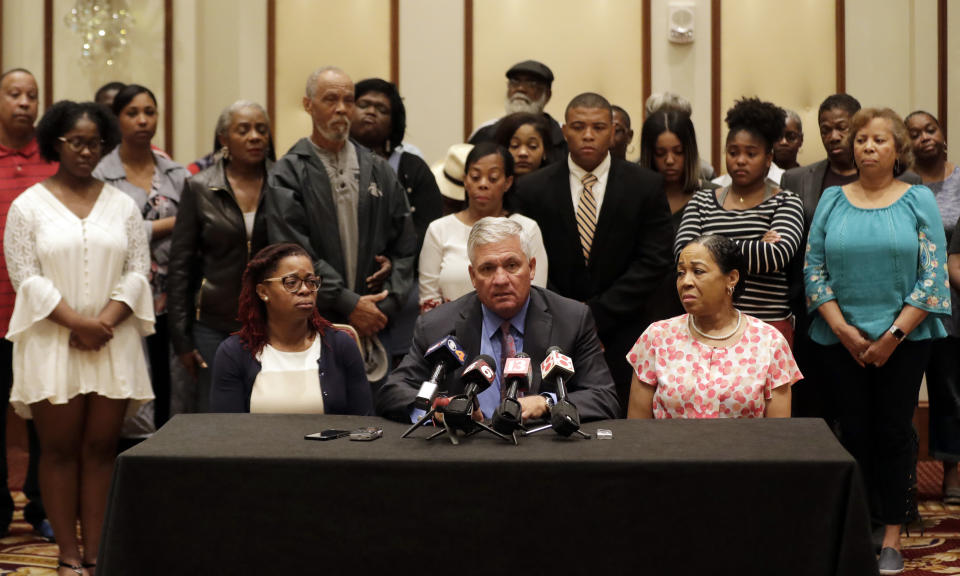 Robert Mongeluzzi, middle, speaks as Kyrie Rose, left, and Lisa Berry listen during a news conference regarding the July 19 duck boat accident, Tuesday, July 31, 2018, in Indianapolis. A second lawsuit has been filed by members of an Indiana family who lost nine relatives when a tourist boat sank this month in Missouri. The federal lawsuit was filed Tuesday in Missouri on behalf of the estates of two members of the Coleman family. They were among 17 people killed in the July 19 sinking near Branson. (AP Photo/Darron Cummings)