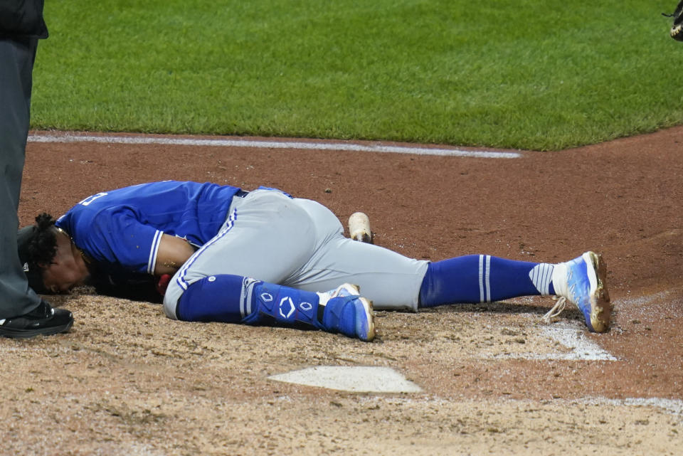 Toronto Blue Jays' Santiago Espinal lies in the batter's box after being hit by a pitch from Pittsburgh Pirates relief pitcher Duane Underwood Jr. during the eighth inning of a baseball game, Saturday, Sept. 3, 2022, in Pittsburgh. Espinal was helped up and walked off the field, and did not return to the game. (AP Photo/Keith Srakocic)
