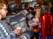 More super heroes... with this Dark Knight sharing his beer. (Photo by Peter Dench/Getty Images)