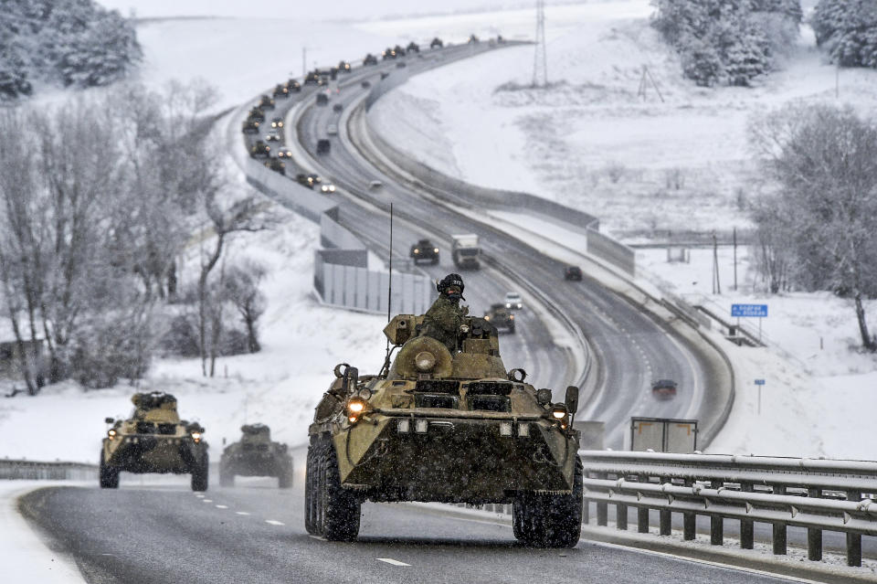 Image: A convoy of Russian armored vehicles moves along a highway in Crimea, on Jan. 18, 2022. (AP)