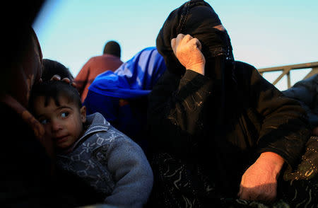 A woman, who just fled a village controled by Islamic State militants, is pictured before heading to a camp at Hammam Ali, south of Mosul, Iraq February 22, 2017. REUTERS/Zohra Bensemra