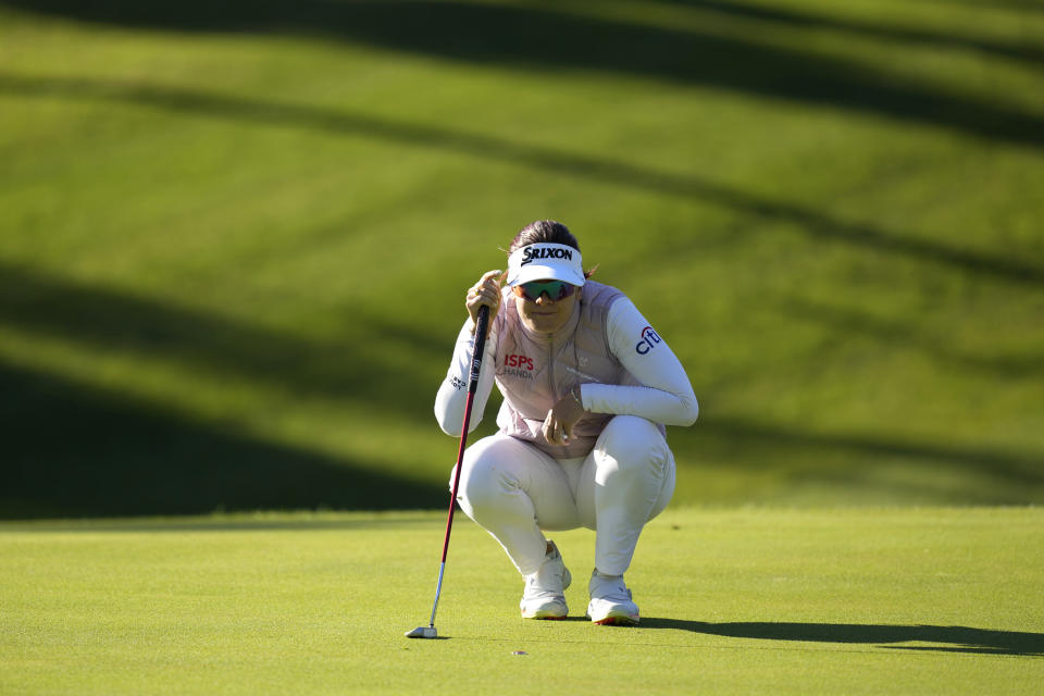 Hannah Green of Australia lines up a putt on the first hole during the third round of the BMW Ladies Championship at LPGA International Busan in Busan, South Korea, Saturday, Oct. 23, 2021. (AP Photo/Lee Jin-man)