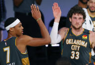 Oklahoma City Thunder's Mike Muscala (33) celebrates with teammate Darius Bazley (7) after sinking the game winning three point basket against the Miami Heat during the second half of an NBA basketball game Wednesday, Aug. 12, 2020, in Lake Buena Vista, Fla. (Kevin C. Cox/Pool Photo via AP)