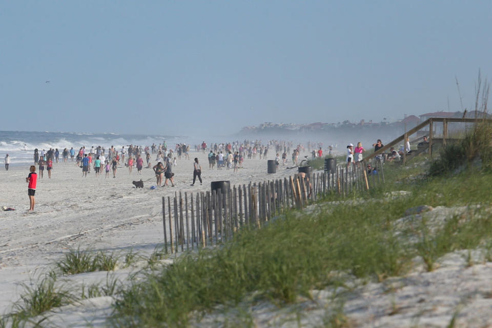 People crowded the beaches in its first open hour in Jacksonville Beach, Florida.