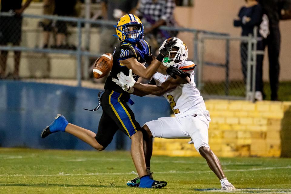 Newberry Panthers cornerback Ian Hubbert (20) breaks up a pass to Hawthorne Hornets wide receiver Alvon Isaac (2) during the first half at Newberry High School in Newberry, FL on Friday, September 1, 2023. [Matt Pendleton/Gainesville Sun]