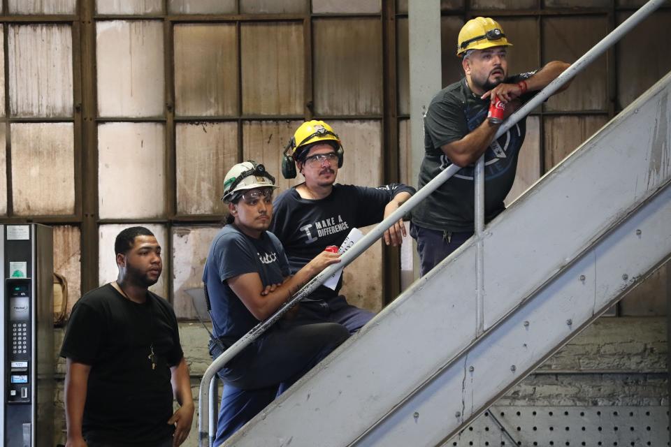 Maynard Steel Casting Co. employees listen to Gov. Scott Walker’s speech during his summer bus tour.