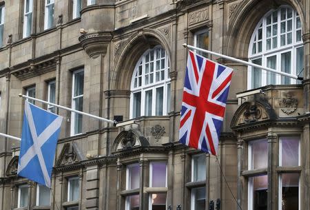 Saltire and Union flags fly in Edinburgh, Scotland March 10, 2017. Picture taken March 10, 2017 REUTERS/Russell Cheyne