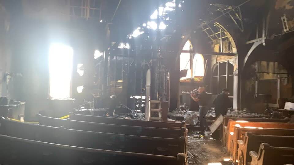 Inside of St. Mary and St. Moses Church, formerly Taftville Congregational Church, after a fire Saturday.