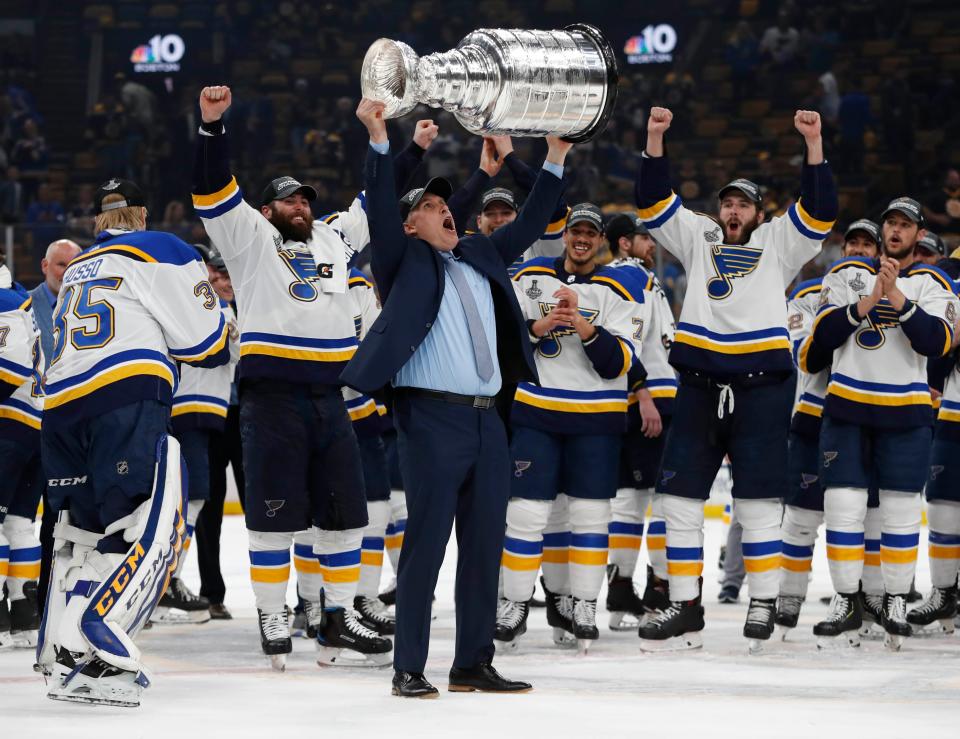 Craig Berube lifts the Stanley Cup after the Blues' Game 7 win over the Bruins in 2019.