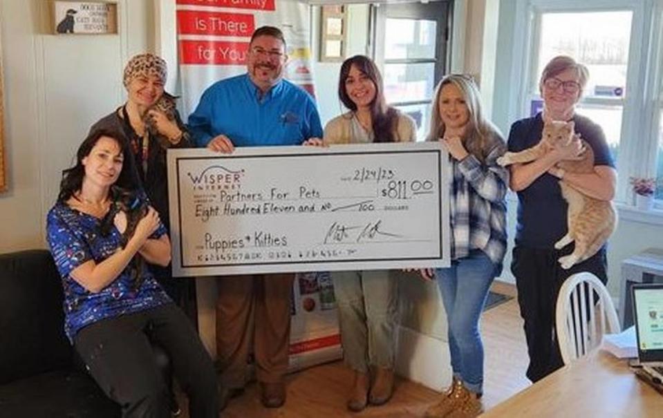 Wisper Internet recently donated the proceeds from an employee trivia night to Partners for Pets, a no kill animal shelter based in St. Jacob. From left, veterinary technicians Lori Miller and Kate Germany; Partners for Pets Executive Director Erika Pratt; Wisper PR and Advocacy Specialist Monte Miller; shelter tech Renee Bradshaw; and kennel tech Sharon Autenrieth.