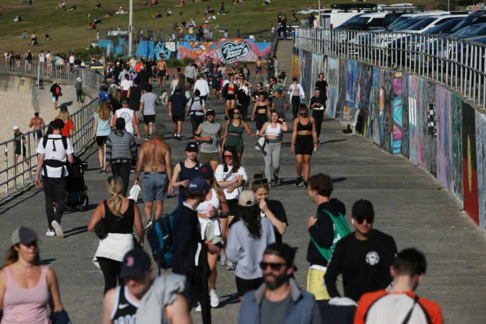 People are seen exercising along the boardwalk at Bondi Beach in Sydney, Australia. 