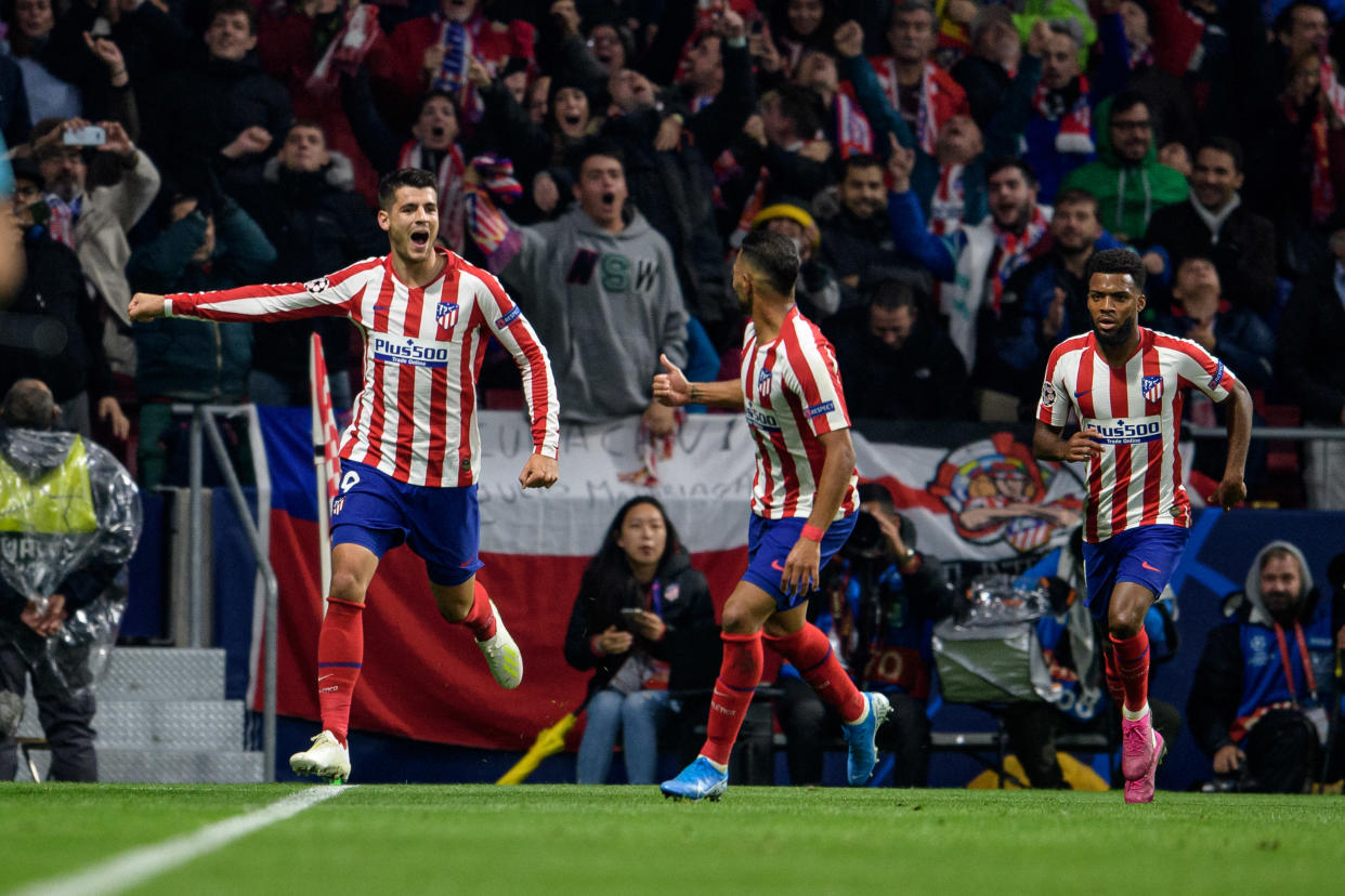 Álvaro Morata (left) celebrates his game-winning goal for Atletico Madrid against Bayer Leverkusen on Tuesday at the Wanda Metropolitano. (Getty)