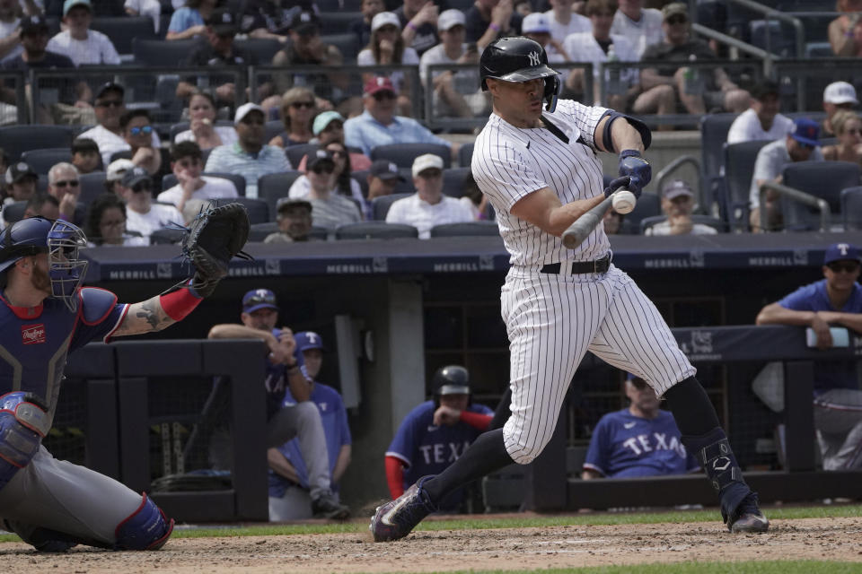 New York Yankees' Giancarlo Stanton swings on a pitch in the sixth inning of a baseball game against the Texas Rangers, Sunday, June 25, 2023, in New York. (AP Photo/Bebeto Matthews)
