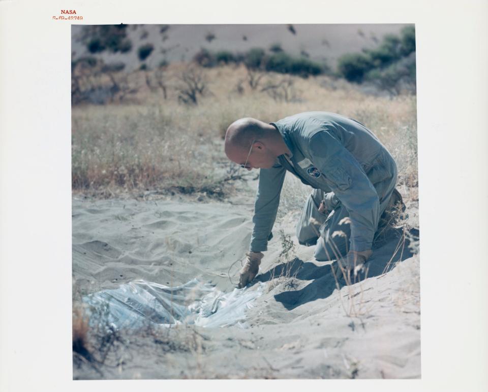 Astronaut Franklin Story Musgrave at a water still made during desert survival training near Pasco, Washington, US, 5th August 1969.