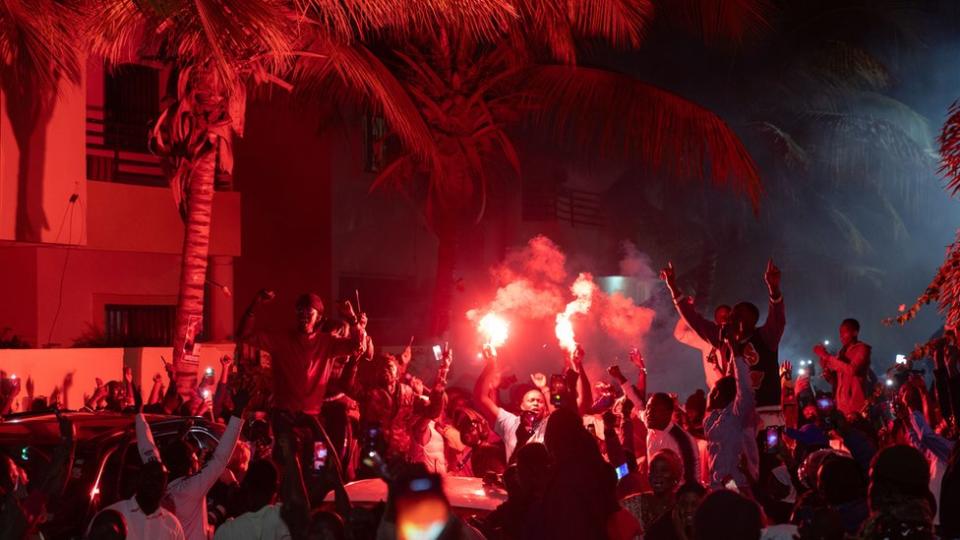 Supporters of opposition politician Ousmane Sonko celebrate his release outside his home in Dakar, Senegal, 15 March 2024.