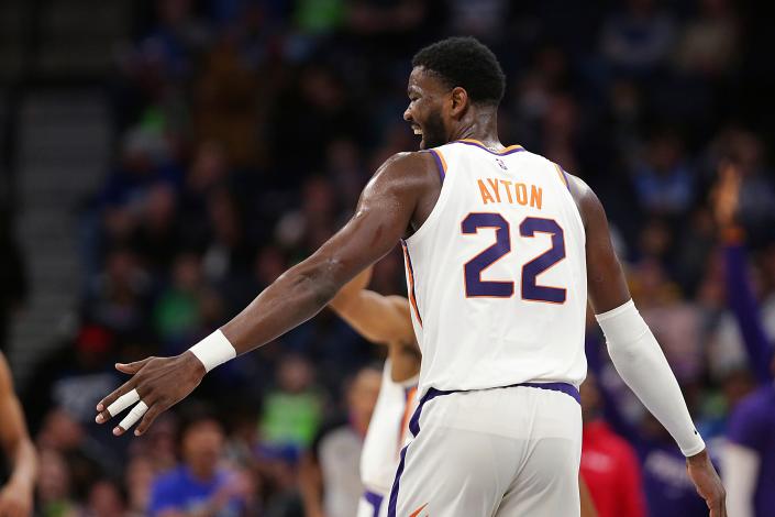 Phoenix Suns center Deandre Ayton celebrates during the second half of the team's NBA basketball game against the Minnesota Timberwolves on Wednesday, March 23, 2022, in Minneapolis.