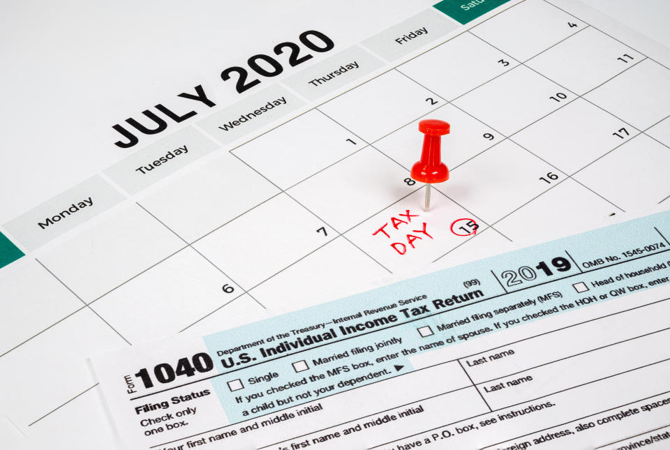 The tax day was extended to July 15th because of Covid-19. July calendar showing 1040 return form and tax day