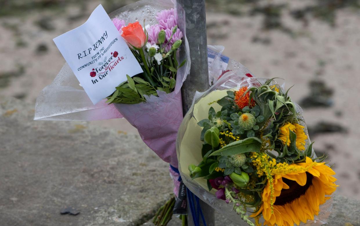 Floral tributes laid at the breakwater at Wardie Bay