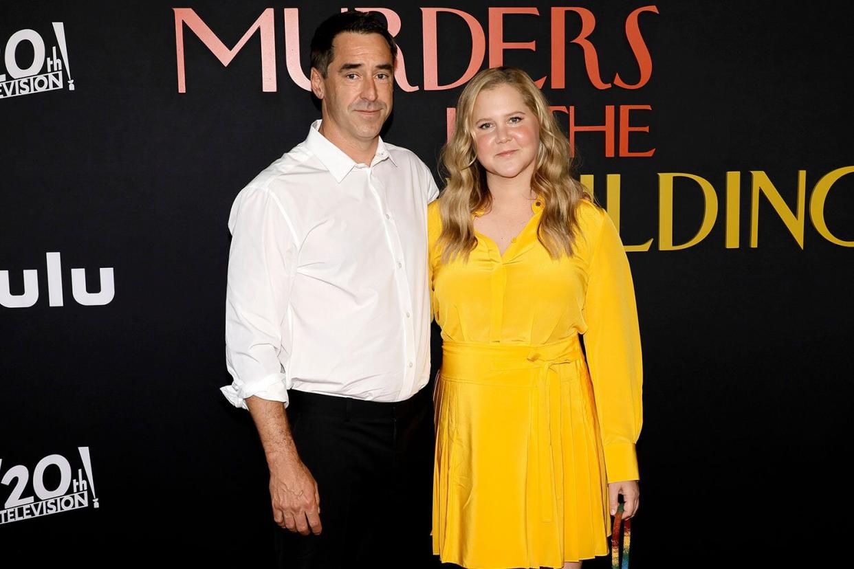 Chris Fischer and Amy Schumer attend the Los Angeles premiere of 